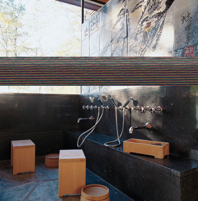 The white cedar bath set was imported from Japan. The walls are Vermont marble and handmade Raku tile; floors are New Hampshire river stone.